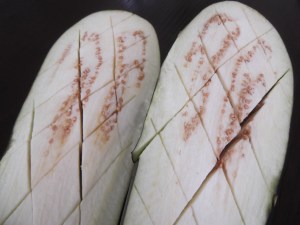 Use a knife to score the eggplant and, using your fingers, rub the oil, salt and pepper into the grooves.